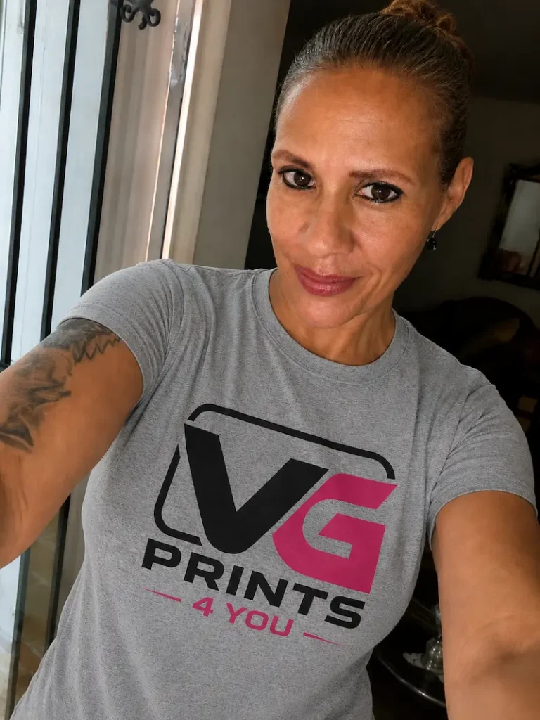 Woman wearing a custom printed t-shirt featuring the VG Prints 4 You logo for branded apparel and promotional products